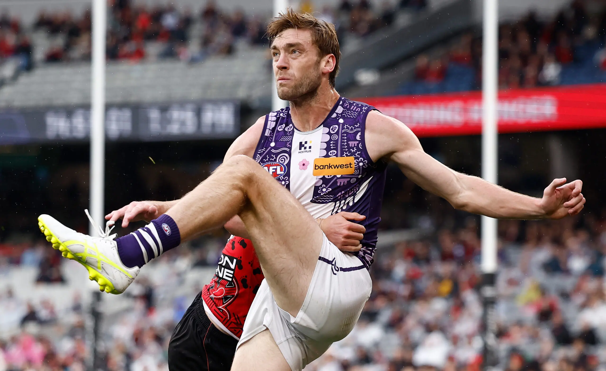 MELBOURNE, AUSTRALIA - MAY 17: Oscar McDonald of the Dockers kicks the ball during the 2026 AFL Round 10 match between the Essendon Bombers and Walyalup (Fremantle Dockers) at the Melbourne Cricket Ground on May 17, 2026 in Melbourne, Australia. (Photo by Michael Willson/AFL Photos via Getty Images)