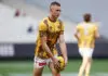 MELBOURNE, AUSTRALIA - MAY 16: Calsher Dear of the Hawks warms up ahead of the round 10 AFL match between Narrm (Melbourne Demons) and Hawthorn Hawks at Melbourne Cricket Ground, on May 16, 2026, in Melbourne, Australia. (Photo by Morgan Hancock/Getty Images)