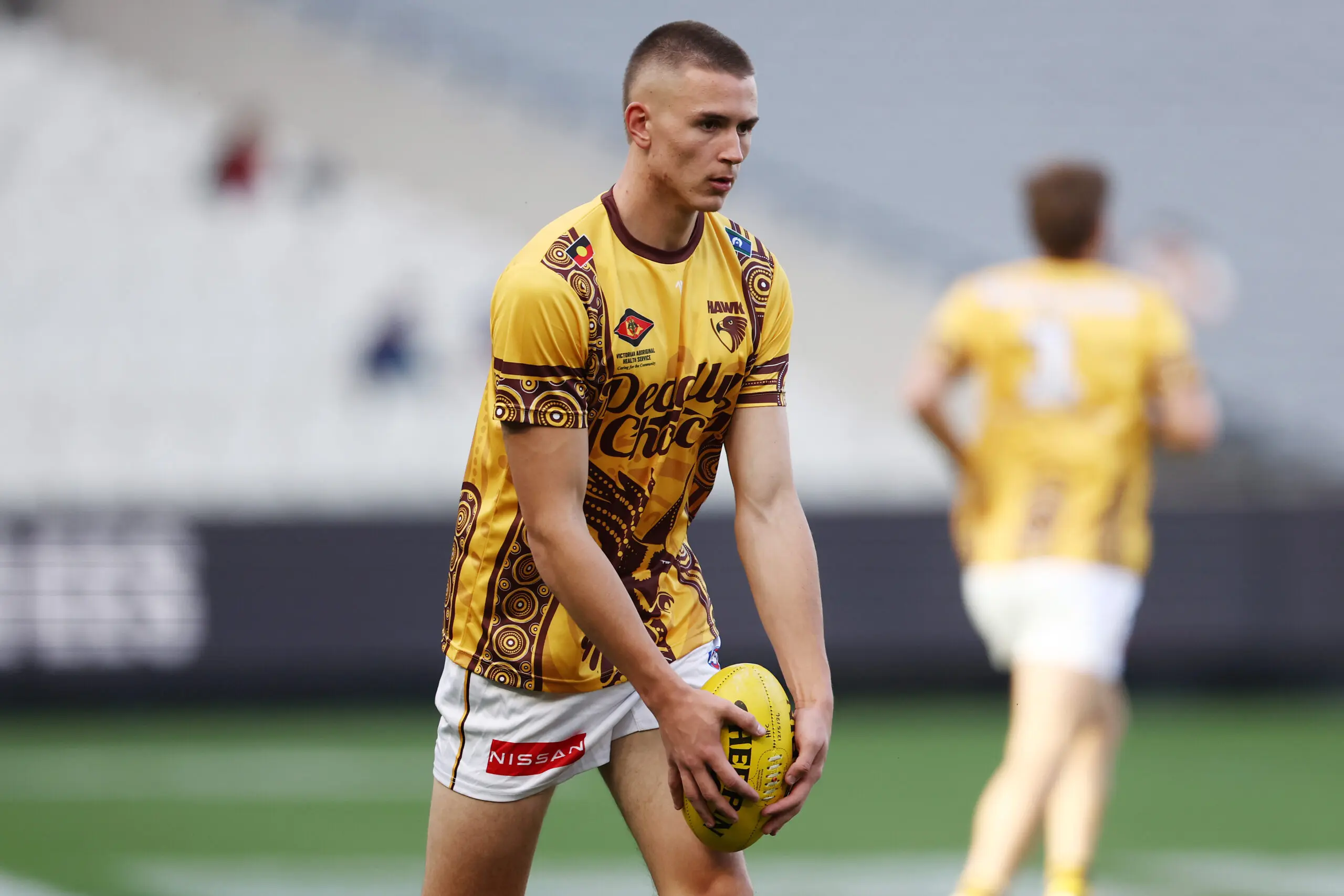 MELBOURNE, AUSTRALIA - MAY 16: Calsher Dear of the Hawks warms up ahead of the round 10 AFL match between Narrm (Melbourne Demons) and Hawthorn Hawks at Melbourne Cricket Ground, on May 16, 2026, in Melbourne, Australia. (Photo by Morgan Hancock/Getty Images)