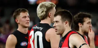 Essendon contracted star talks on McVeigh meeting, future beyond 2026 MELBOURNE, AUSTRALIA - AUGUST 02: Zach Merrett of the Bombers looks dejected after a loss during the 2026 AFL Round 21 match between the Essendon Bombers and the Adelaide Crows at Marvel Stadium on August 2, 2026 in Melbourne, Australia. (Photo by Michael Willson/AFL Photos via Getty Images)
