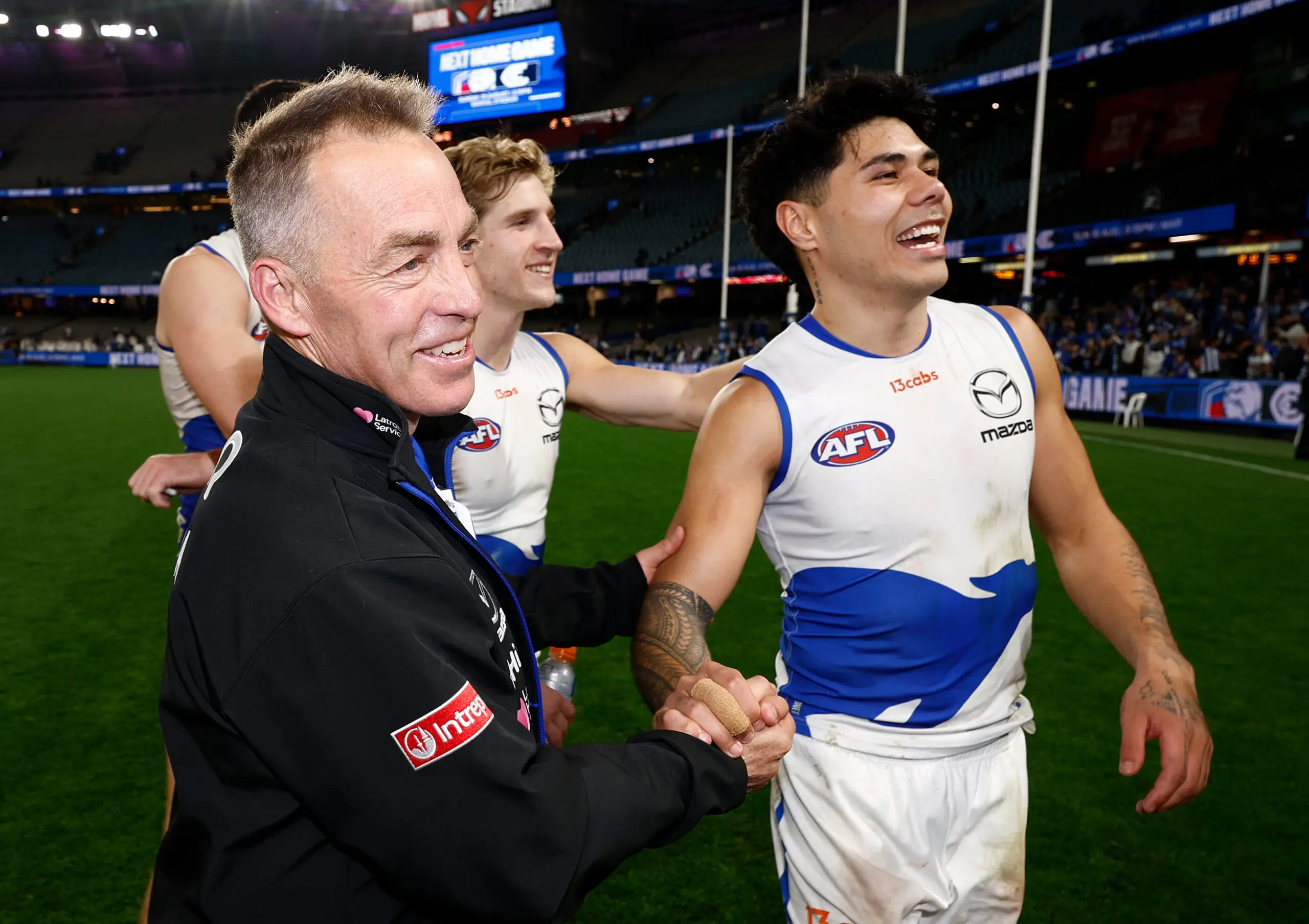 MELBOURNE, AUSTRALIA - AUGUST 06: Alastair Clarkson, Senior Coach of the Kangaroos and Paul Curtis of the Kangaroos celebrate during the 2026 AFL Round 22 match between the Western Bulldogs and the North Melbourne Kangaroos at Marvel Stadium on August 6, 2026 in Melbourne, Australia. (Photo by Michael Willson/AFL Photos via Getty Images)