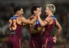 BRISBANE, AUSTRALIA - AUGUST 07: Kai Lohmann of the Lions celebrates with team mates after kicking a goal during the round 22 AFL match between Brisbane Lions and Hawthorn Hawks at The Gabba, on August 07, 2026, in Brisbane, Australia. (Photo by Albert Perez/AFL Photos via Getty Images)