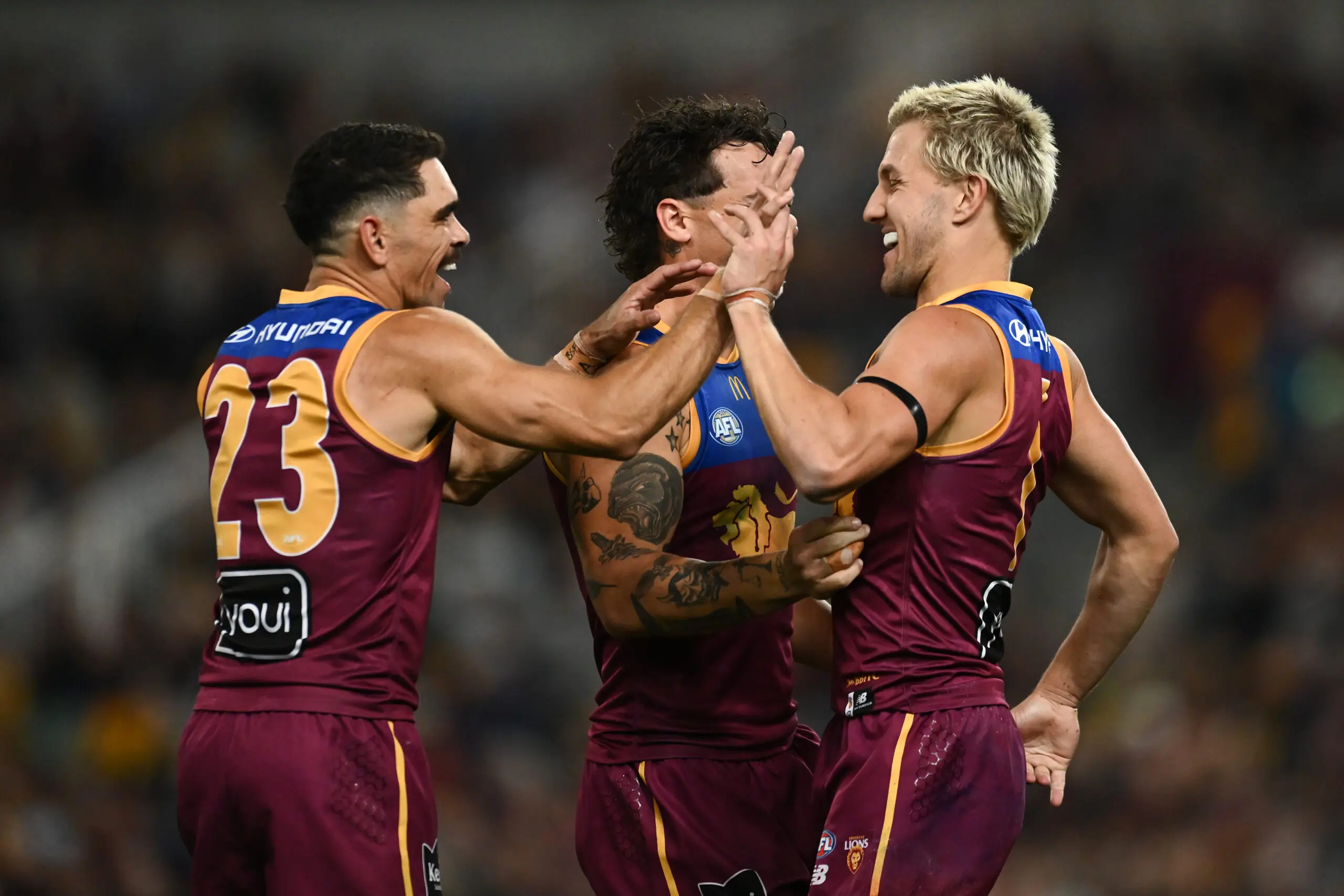 BRISBANE, AUSTRALIA - AUGUST 07: Kai Lohmann of the Lions celebrates with team mates after kicking a goal during the round 22 AFL match between Brisbane Lions and Hawthorn Hawks at The Gabba, on August 07, 2026, in Brisbane, Australia. (Photo by Albert Perez/AFL Photos via Getty Images)