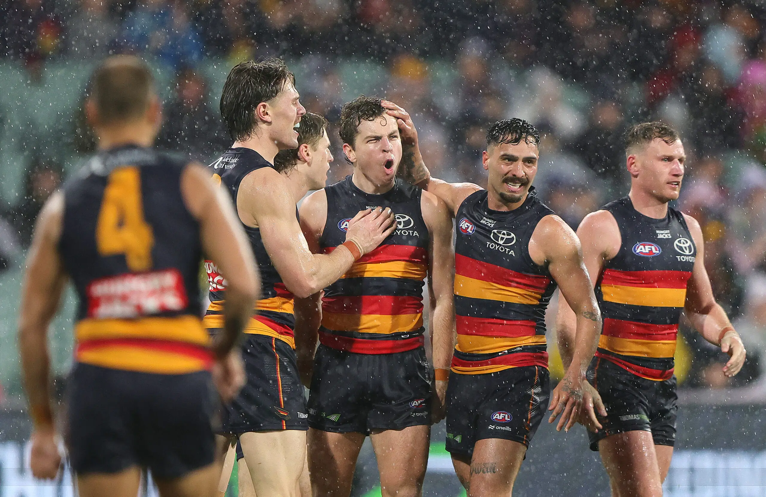 ADELAIDE, AUSTRALIA - AUGUST 08: Zac Taylor of the Crows celebrates a goal with team mates during the round 22 AFL match between Adelaide Crows and Richmond Tigers at Adelaide Oval, on August 08, 2026, in Adelaide, Australia. (Photo by Sarah Reed/AFL Photos/via Getty Images)