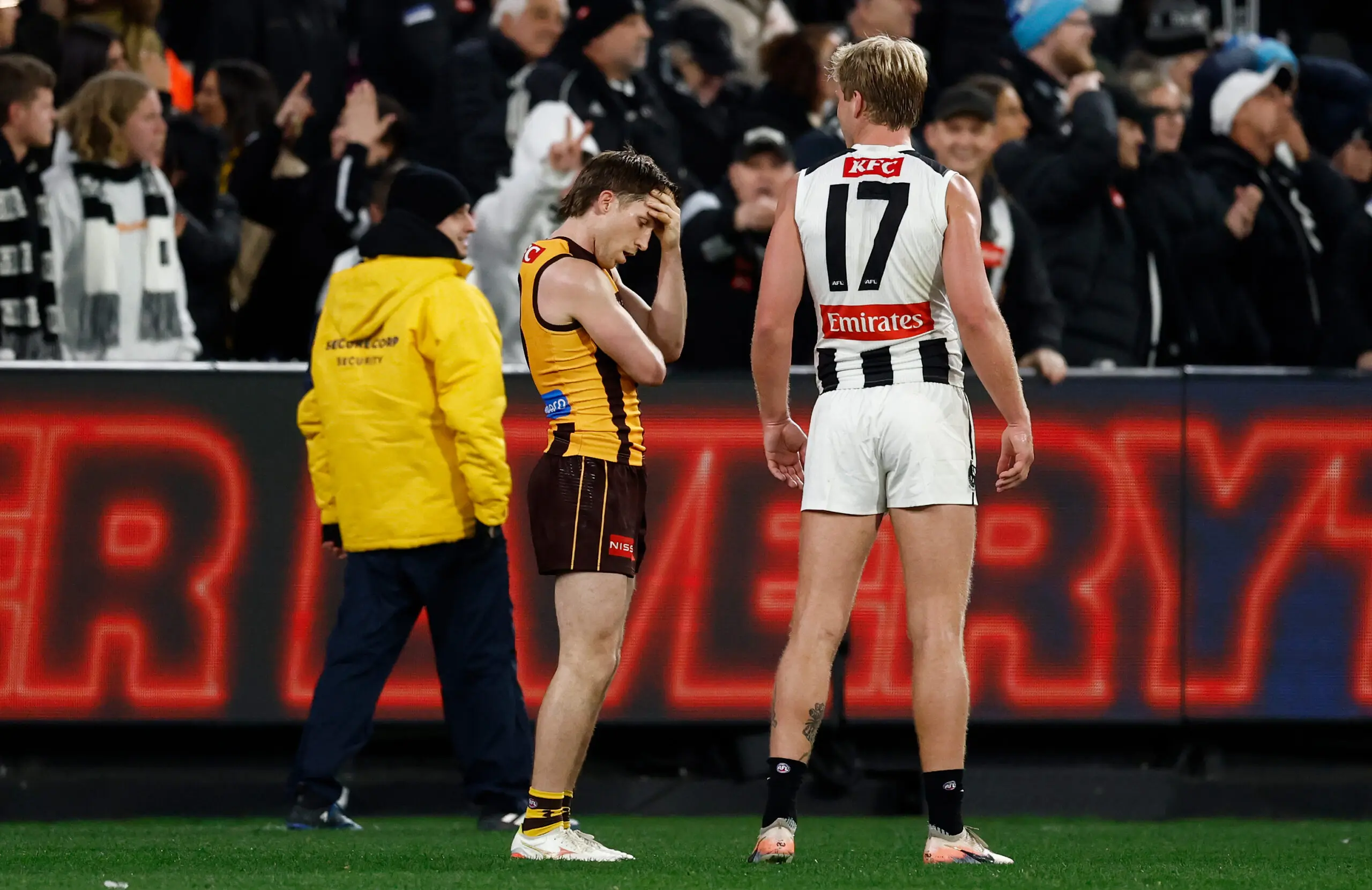 MELBOURNE, AUSTRALIA - AUGUST 15: Dylan Moore of the Hawks is consoled by Billy Frampton of the Magpies after missing a shot after the siren to win the match during the 2026 AFL Round 23 match between the Hawthorn Hawks and the Collingwood Magpies at the Melbourne Cricket Ground on August 15, 2026 in Melbourne, Australia. (Photo by Michael Willson/AFL Photos via Getty Images)