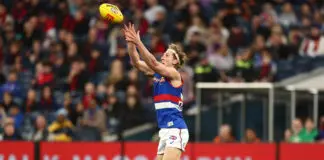 Bulldogs and Demons count injury toll as AFL Wildcard Round awaits MELBOURNE, AUSTRALIA - AUGUST 22: Aaron Naughton of the Bulldogs marks the ball during the 2026 AFL Round 24 match between the Melbourne Demons and the Western Bulldogs at the Melbourne Cricket Ground on August 22, 2026 in Melbourne, Australia. (Photo by James Wiltshire/AFL Photos via Getty Images)