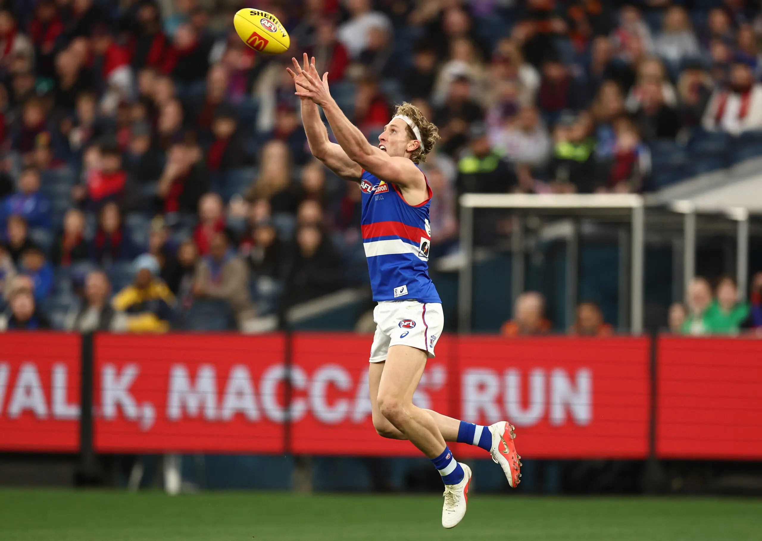 MELBOURNE, AUSTRALIA - AUGUST 22: Aaron Naughton of the Bulldogs marks the ball during the 2026 AFL Round 24 match between the Melbourne Demons and the Western Bulldogs at the Melbourne Cricket Ground on August 22, 2026 in Melbourne, Australia. (Photo by James Wiltshire/AFL Photos via Getty Images)