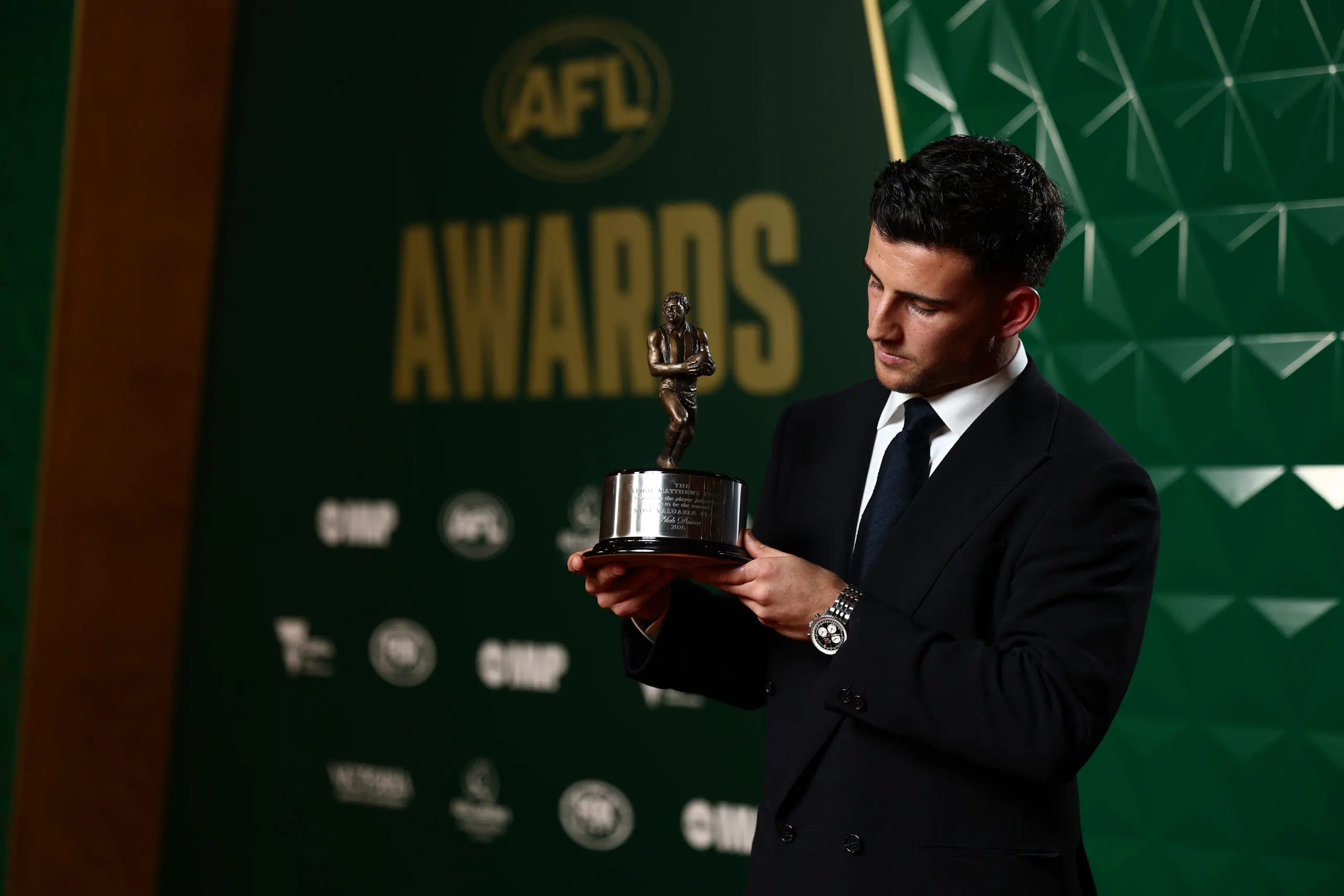 MELBOURNE, AUSTRALIA - AUGUST 25: Nick Daicos of the Magpies poses with the Leigh Matthews Trophy for Most Valuable Player award during the 2026 AFL Awards at Centrepiece on August 25, 2026 in Melbourne, Australia. (Photo by James Wiltshire/AFL Photos via Getty Images)