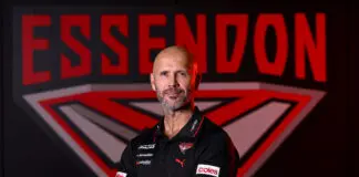 Essendon coach speaks on James Hird, gamestyle and more MELBOURNE, AUSTRALIA - AUGUST 25: Mark McVeigh the new coach of the Bombers poses during an Essendon Bombers AFL press conference at The Hangar on August 25, 2026 in Melbourne, Australia. (Photo by Quinn Rooney/Getty Images)