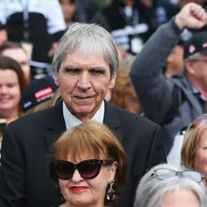 MELBOURNE, AUSTRALIA - MAY 06:  Magpies legend Peter McKenna with Magpies fans as they march together for their 125 year celebrations during the round seven AFL match between the Collingwood Magpies and the Carlton Blues at Melbourne Cricket Ground on May 6, 2017 in Melbourne, Australia.  (Photo by Michael Dodge/Getty Images)
