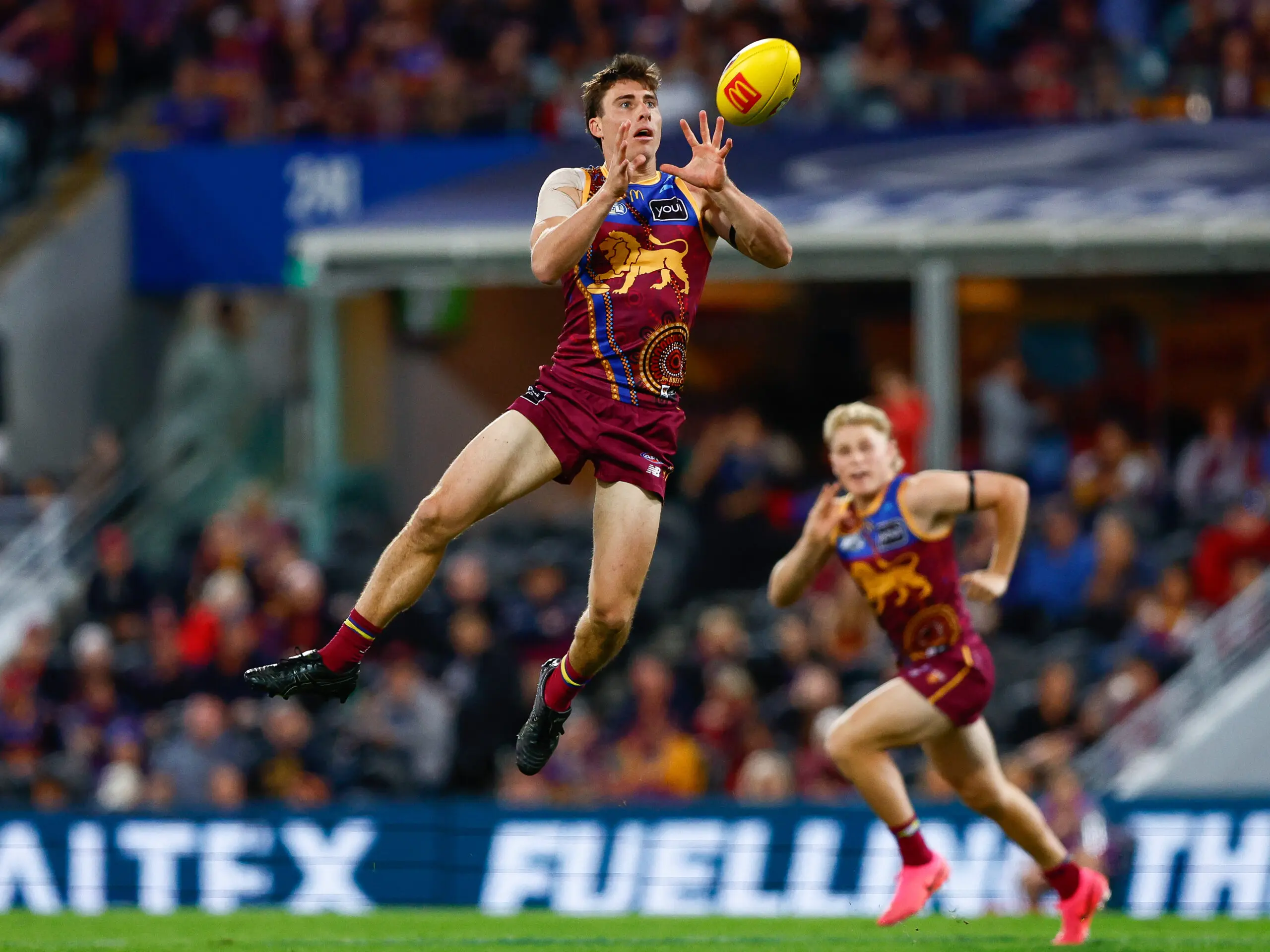 BRISBANE, AUSTRALIA - JULY 12: Noah Answerth of the Lions marks the ball during the 2026 AFL Round 18 match between the Brisbane Lions and the Essendon Bombers at the Gabba on July 12, 2026 in Brisbane, Australia. (Photo by Russell Freeman/AFL Photos via Getty Images)