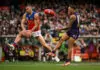 MELBOURNE, AUSTRALIA - SEPTEMBER 26: Josh Dunkley of the Lions spoils the kick from Shai Bolton of the Dockers during the AFL Grand Final match between the Fremantle Dockers and the Brisbane Lions at the Melbourne Cricket Ground on September 26, 2026 in Melbourne, Australia. (Photo by Daniel Carson/AFL Photos via Getty Images)