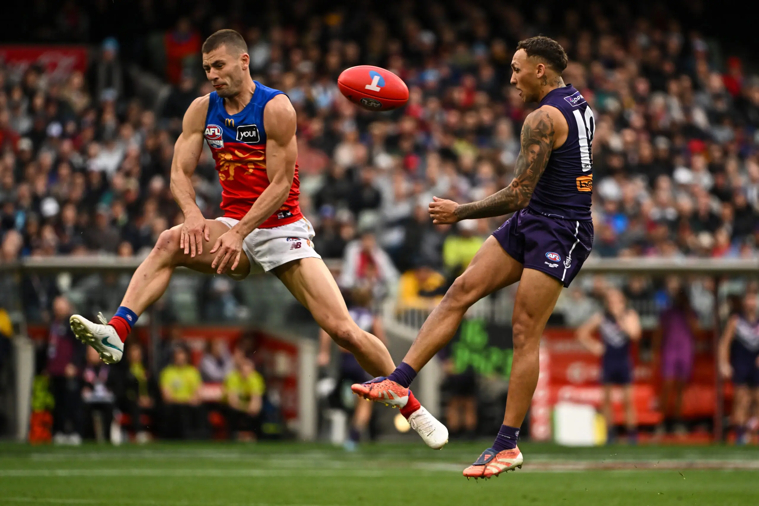 MELBOURNE, AUSTRALIA - SEPTEMBER 26: Josh Dunkley of the Lions spoils the kick from Shai Bolton of the Dockers during the AFL Grand Final match between the Fremantle Dockers and the Brisbane Lions at the Melbourne Cricket Ground on September 26, 2026 in Melbourne, Australia. (Photo by Daniel Carson/AFL Photos via Getty Images)