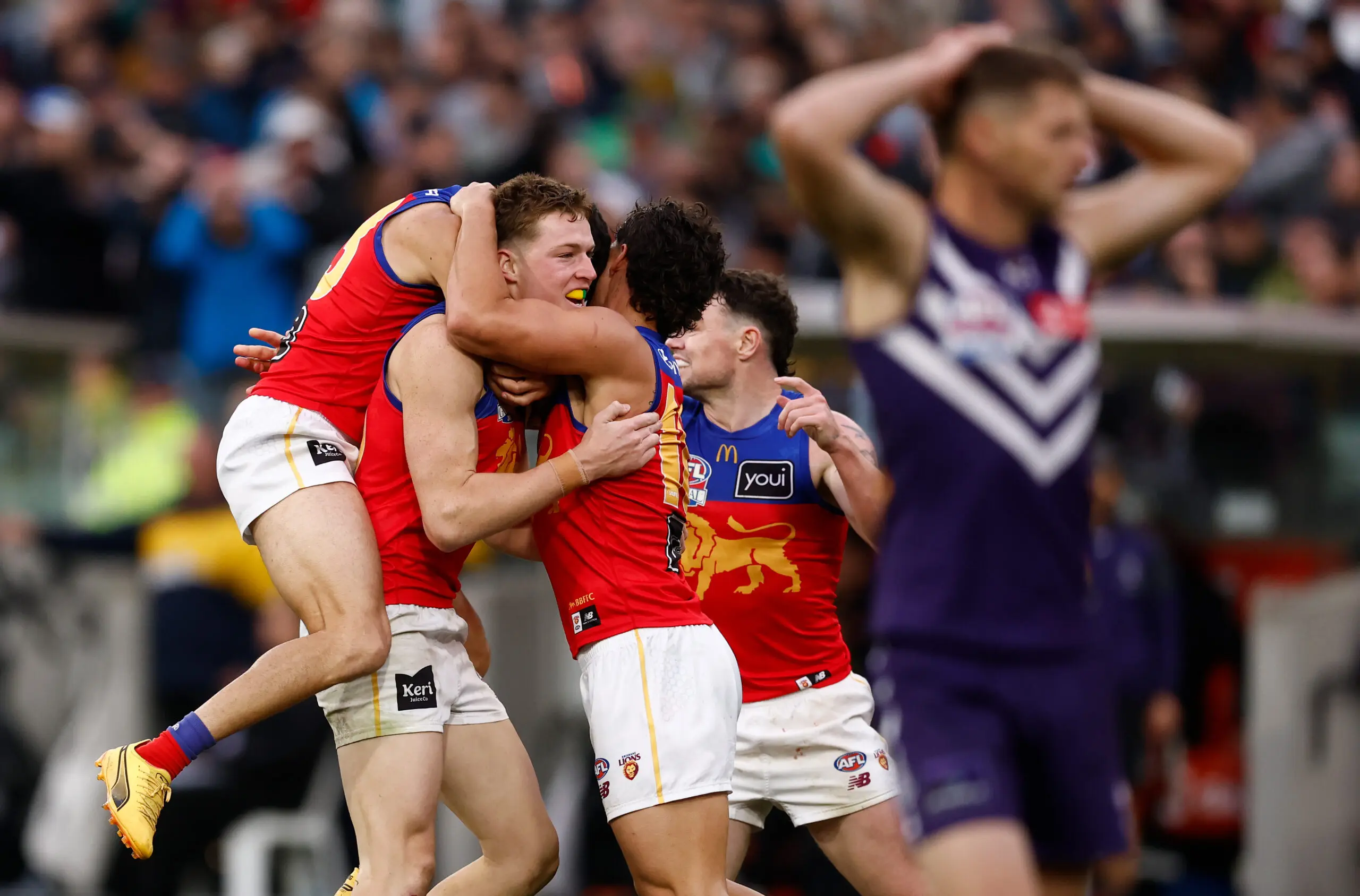 MELBOURNE, AUSTRALIA - SEPTEMBER 26: Logan Morris of the Lions celebrates a goal with teammates during the AFL Grand Final match between the Fremantle Dockers and the Brisbane Lions at the Melbourne Cricket Ground on September 26, 2026 in Melbourne, Australia. (Photo by Michael Willson/AFL Photos via Getty Images)