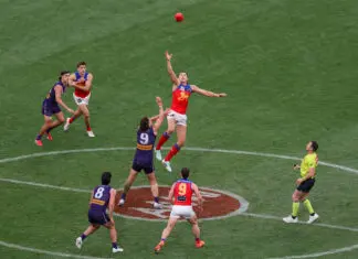 MELBOURNE, AUSTRALIA - SEPTEMBER 26: Sam Draper of the Lions and Luke Jackson of the Dockers contest a centre ball up during the AFL Grand Final match between the Fremantle Dockers and the Brisbane Lions at the Melbourne Cricket Ground on September 26, 2026 in Melbourne, Australia. (Photo by Craig Dooley/AFL Photos via Getty Images)