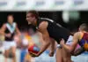 “Deeply saddened”: Former Port Adelaide key forward passes away BRISBANE, AUSTRALIA - JULY 03: Daniel Stewart of the Power is tackled by Bryce Retzlaff of the Lions during the round 15 AFL match between the Brisbane Lions and Port Adelaide Power at The Gabba on July 3, 2011 in Brisbane, Australia. (Photo by Chris Hyde/Getty Images)