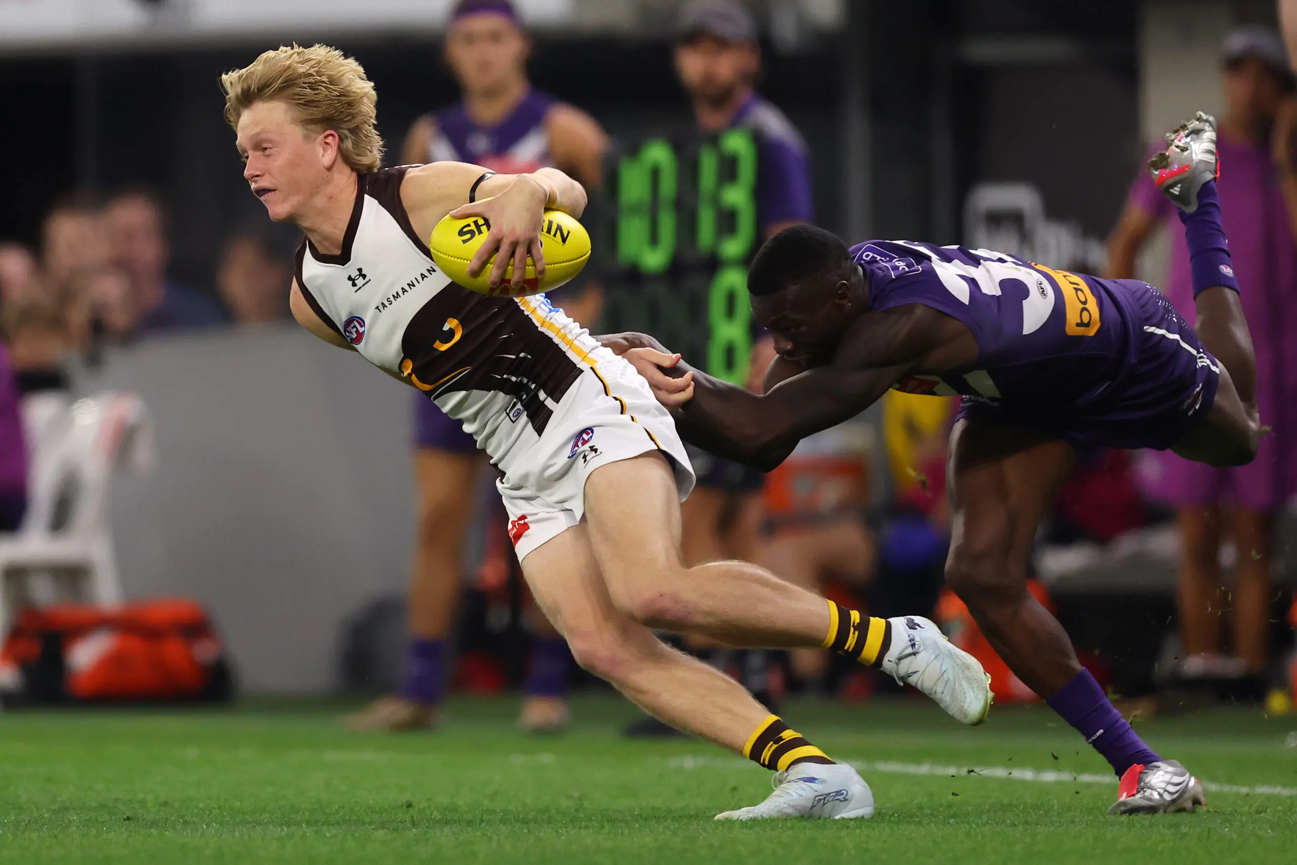 PERTH, AUSTRALIA - MAY 07: Bodie Ryan of the Hawks breaks from a tackle by MFduring the round nine AFL match between Fremantle Dockers and Hawthorn Hawks at Optus Stadium, on May 07, 2026, in Perth, Australia. (Photo by Paul Kane/Getty Images)