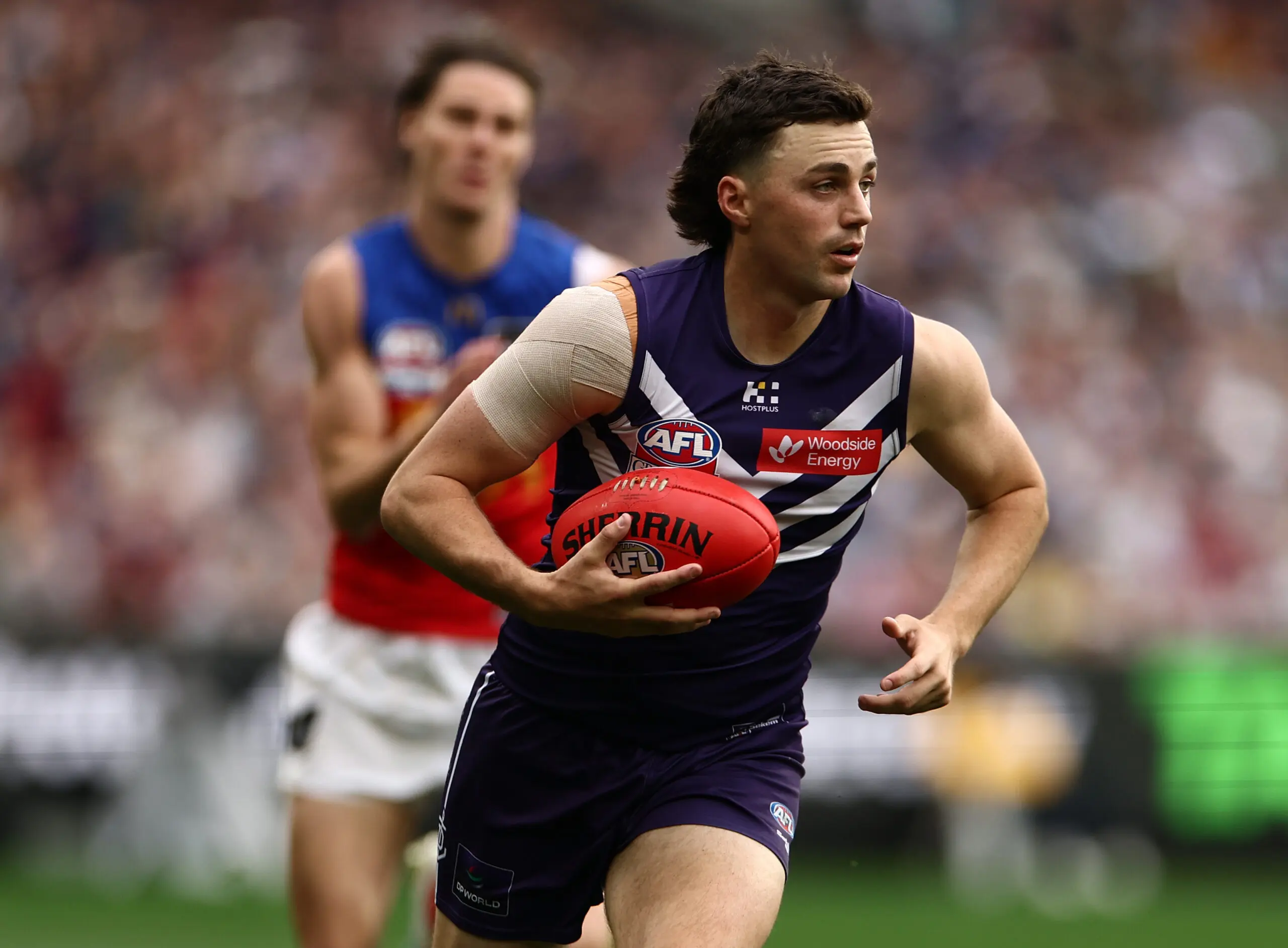 MELBOURNE, AUSTRALIA - SEPTEMBER 26: Jordan Clark of the Dockers runs with the ball during the AFL Grand Final match between the Fremantle Dockers and the Brisbane Lions at the Melbourne Cricket Ground on September 26, 2026 in Melbourne, Australia. (Photo by James Wiltshire/AFL Photos via Getty Images)