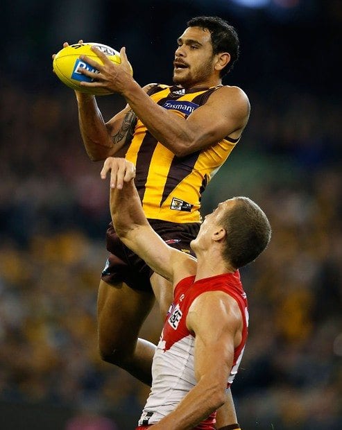 Cyril leaps over Ted Richards to complete an impressive marl. Picture: Michael Willson/AFL Media.