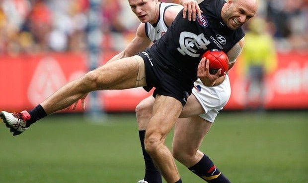 Chris Judd injures his knee on Saturday afternoon against Adelaide. Source: AFL Media.