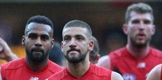 MELBOURNE, AUSTRALIA - MAY 16:  Heritier Lumumba and Jimmy Toumpas of the Demons  look dejected as they leave the field after losing the round seven AFL match between the Hawthorn Hawks and the Melbourne Demons at Melbourne Cricket Ground on May 16, 2015 in Melbourne, Australia.  (Photo by Quinn Rooney/Getty Images)