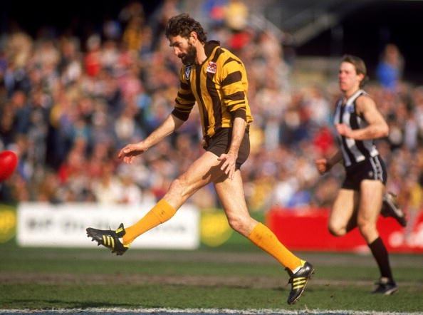 MELBOURNE, AUSTRALIA - 1988: Michael Tuck of the Hawks in action during the 1988 AFL season played between the Hawthorn Hawks and the Collingwood Magpies held at the Melbourne Cricket Ground, 1988 in Melbourne, Australia. (Photo by Getty Images).
