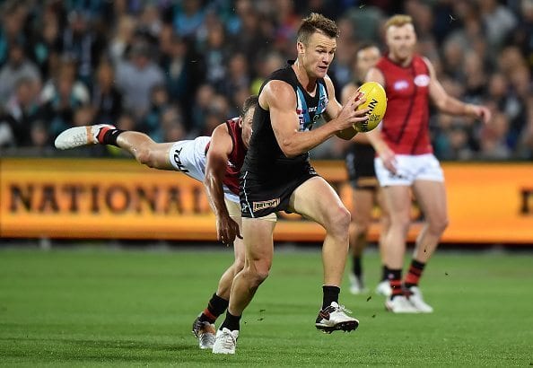 ADELAIDE, AUSTRALIA - APRIL 08: Robbie Gray of the Power evades a tackle during the round three AFL match between the Port Adelaide Power and the Essendon Bombers at Adelaide Oval on April 8, 2016 in Adelaide, Australia. (Photo by Daniel Kalisz/Getty Images)