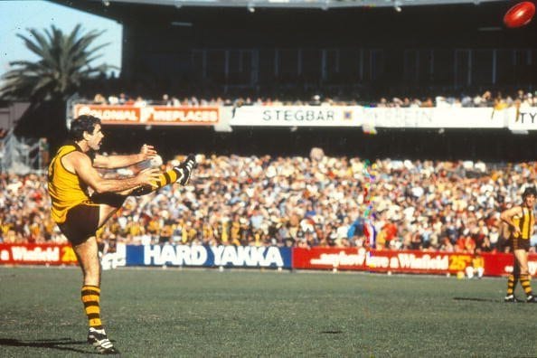 MELBOURNE, AUSTRALIA - 1980s: Leigh Matthews of the Hawthorn Hawks kicks for goal during a VFL match. (Photo by Getty Images)
