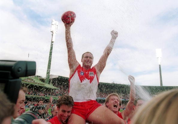 6 Jun 1999:  Tony Lockett of Sydney Swans celebrates  after kicking his 1300th goal to break the Gordon Coventry's previous record of 1299 during the match between Sydney Swans v Collingwood Magpies at the Sydney Cricket Ground, Sydney, Australia. Mandatory Credit: Adam Pretty/ALLSPORT