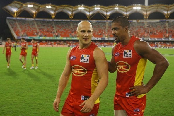 GOLD COAST, AUSTRALIA - MARCH 30: Gary Ablett and Joel Wilkinson of the Suns celebrate winning the round one AFL match between the Gold Coast Suns and the St Kilda Saints at Metricon Stadium on March 30, 2013 in Gold Coast, Australia. (Photo by Chris Hyde/Getty Images)