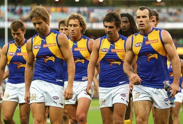 MELBOURNE, AUSTRALIA - APRIL 03: The Eagles look dejected after losing the round two AFL match between the Hawthorn Hawks and the West Coast Eagles at the Melbourne Cricket Ground on April 3, 2016 in Melbourne, Australia. (Photo by Quinn Rooney/Getty Images)