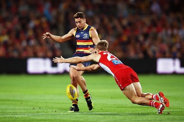 ADELAIDE, AUSTRALIA - APRIL 16: Rory Atkins of the Crows kicks the ball during the round four AFL match between the Adelaide Crows and the Sydney Swans at Adelaide Oval on April 16, 2016 in Adelaide, Australia.  (Photo by Morne de Klerk/Getty Images)