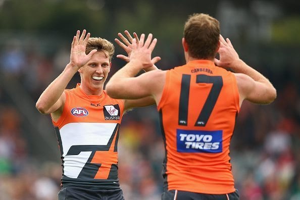 CANBERRA, AUSTRALIA - APRIL 17: Lachie Whitfield of the Giants congratulates team mate Steve Johnson of the Giants after kicking a goal during the round four AFL match between the Greater Western Sydney Giants and the Port Adelaide Power at Star Track Oval on April 17, 2016 in Canberra, Australia.  (Photo by Cameron Spencer/Getty Images)