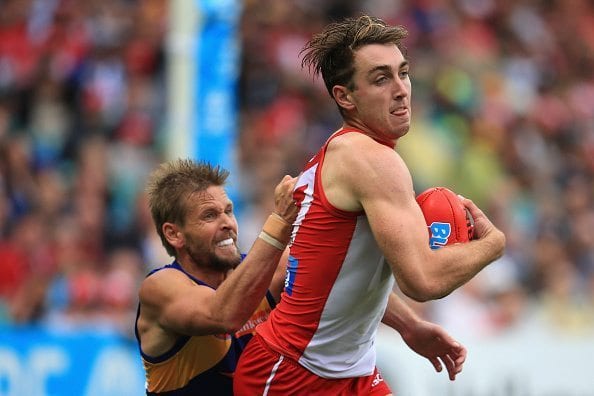 SYDNEY, AUSTRALIA - APRIL 23: Daniel Robinson of the Swans is tackled during the round five AFL match between the Sydney Swans and the West Coast Eagles at Sydney Cricket Ground on April 23, 2016 in Sydney, Australia. (Photo by Cameron Spencer/Getty Images)