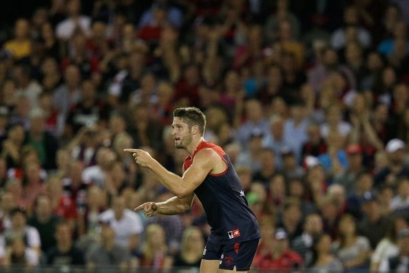 MELBOURNE, VICTORIA - APRIL 30:  Jesse Hogan of the Demons celebrates a goal  during the round six AFL match between the Melbourne Demons and the St Kilda Saints at Etihad Stadium on April 30, 2016 in Melbourne, Australia.  (Photo by Darrian Traynor/AFL Media/Getty Images)