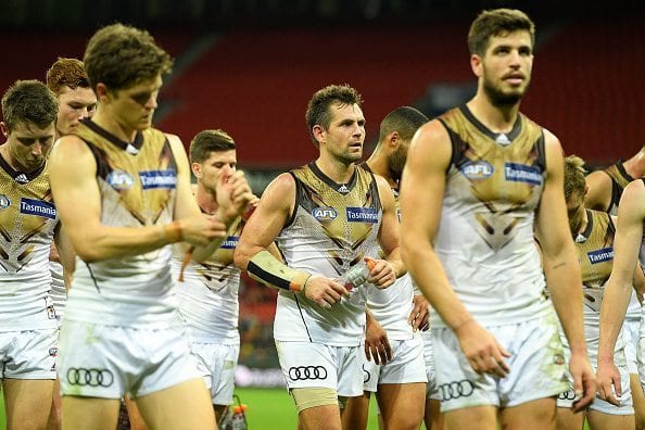 SYDNEY, AUSTRALIA - APRIL 30:  Hawks players show their dejection as they leave the field during the round six AFL match between the Greater Western Sydney Giants and the Hawthorn Hawks at Spotless Stadium on April 30, 2016 in Sydney, Australia.  (Photo by Brett Hemmings/AFL Media/Getty Images)