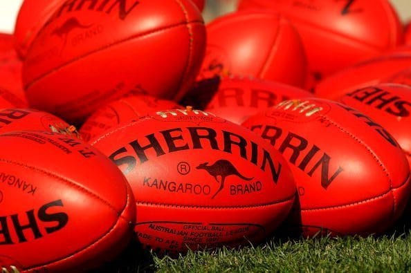 MELBOURNE, AUSTRALIA - MARCH 25:  Sherrin footballs are placed to be collected by Kangaroos players during a North Melbourne Kangaroos training session at the Arden Street Ground on March 25, 2010 in Melbourne, Australia.  (Photo by Mark Dadswell/Getty Images)