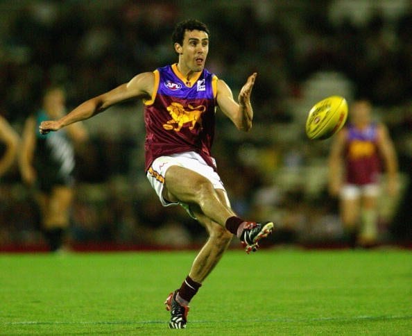 ADELAIDE, AUSTRALIA - APRIL 5: Nigel Lappin #44 of Brisbane punts the ball during the Round two AFL match between Port Adelaide Power and the Brisbane Lions on April 5 , 2003 at AAMI Stadium in Adelaide, Australia. (Photo by Tony Lewis/Getty Images)