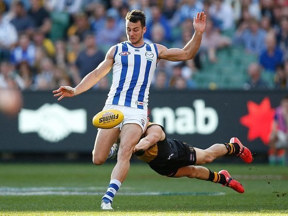 MELBOURNE, AUSTRALIA - SEPTEMBER 13: Robbie Tarrant of the Kangaroos and Brandon Ellis of the Tigers in action during the 2015 AFL First Elimination Final match between the Richmond Tigers and the North Melbourne Kangaroos at the Melbourne Cricket Ground, Melbourne, Australia on September 13, 2015. (Photo by Michael Willson/AFL Media/Getty Images)