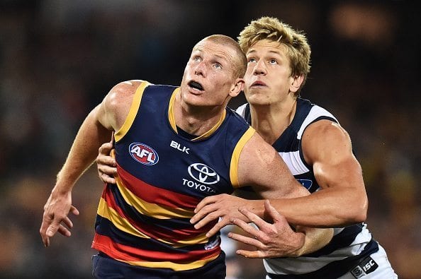 ADELAIDE, AUSTRALIA - MAY 13: (L-R) Sam Jacobs of the Crows competes for the ruck with Rhys Stanley of the Cats during the round eight AFL match between the Adelaide Crows and the Geelong Cats at Adelaide Oval on May 13, 2016 in Adelaide, Australia. (Photo by Daniel Kalisz/Getty Images)