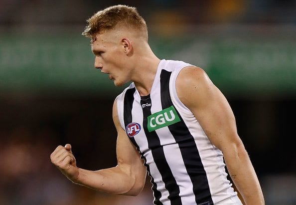 BRISBANE, AUSTRALIA - MAY 14: Adam Treloar of the Magpies celebrates a goal during the 2016 AFL Round 08 match between the Brisbane Lions and the Collingwood Magpies at The Gabba on May 14, 2016 in Brisbane, Australia. (Photo by Michael Willson/AFL Media/Getty Images)