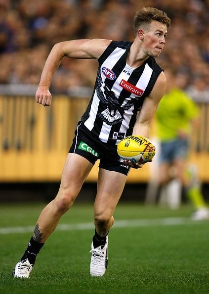 MELBOURNE, AUSTRALIA - MAY 29: Ben Crocker of the Magpies handpasses the ball during the 2016 AFL Round 10 match between the Collingwood Magpies and the Western Bulldogs at the Melbourne Cricket Ground on May 29, 2016 in Melbourne, Australia. (Photo by Adam Trafford/AFL Media/Getty Images)