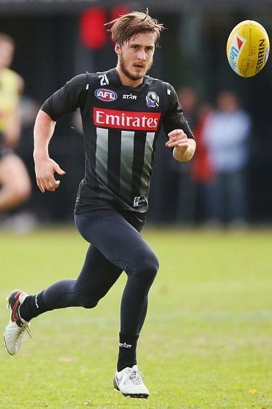 MELBOURNE, AUSTRALIA - JUNE 09:  Tom Phillips of the Magpies runs for the ball during a Collingwood Magpies AFL media opportunity at the Glasshouse Theatre on June 9, 2016 in Melbourne, Australia.  (Photo by Michael Dodge/Getty Images)