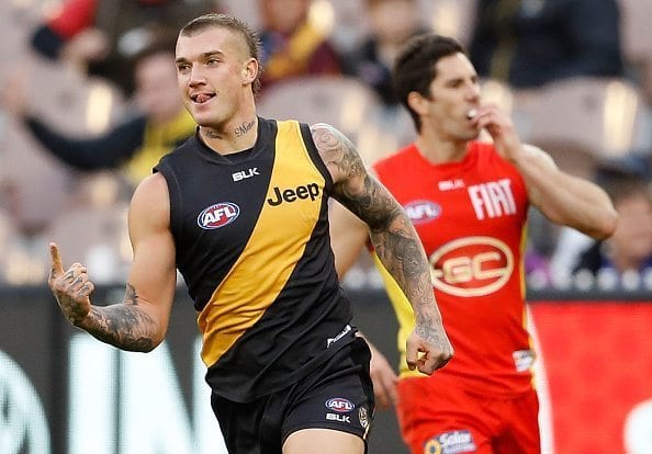 MELBOURNE, AUSTRALIA - JUNE 12: Dustin Martin of the Tigers celebrates a goal during the 2016 AFL Round 12 match between the Richmond Tigers and the Gold Coast Suns at the Melbourne Cricket Ground on June 12, 2016 in Melbourne, Australia.