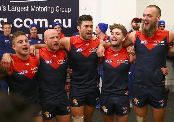 MELBOURNE, AUSTRALIA - JUNE 13: Ben Kennedy, Nathan Jones, Chris Dawes, Tomas Bugg and Max Gawn of the Demons sing the song in the rooms after winning the round 12 AFL match between the Melbourne Demons and the Collingwood Magpies at Melbourne Cricket Ground on June 13, 2016 in Melbourne, Australia. (Photo by Quinn Rooney/Getty Images)