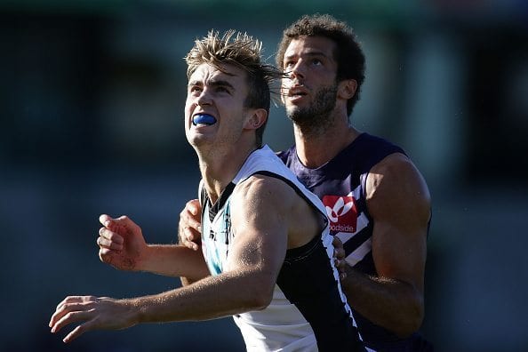 PERTH, AUSTRALIA - JUNE 18: Dougal Howard of the Power contests a ruck with Zac Clarke of the Dockers during the 2016 AFL Round 13 match between the Fremantle Dockers and Port Adelaide Power at Domain Stadium on June 18, 2016 in Perth, Australia. (Photo by Will Russell/AFL Media)