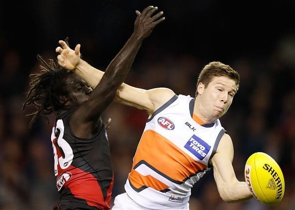 MELBOURNE, AUSTRALIA - JUNE 19: Anthony McDonald-Tipungwuti of the Bombers and Toby Greene of the Giants compete for the ball during the 2016 AFL Round 13 match between the Essendon Bombers and the GWS Giants at Etihad Stadium on June 19, 2016 in Melbourne, Australia. (Photo by Michael Willson/AFL Media/Getty Images)