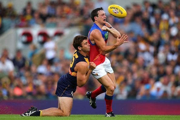PERTH, WESTERN AUSTRALIA - MARCH 27: Jamie Cripps of the Eagles tackles Lewis Taylor of the Lions during the AFL round one match between the West Coast Eagles and the Brisbane Lions at Domain Stadium on March 27, 2016 in Perth, Australia. (Photo by Paul Kane/Getty Images)