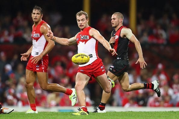 SYDNEY, AUSTRALIA - MAY 07: Tom Mitchell of the Swans kicks the ball during the round seven AFL match between the Sydney Swans and the Essendon Bombers at Sydney Cricket Ground on May 7, 2016 in Sydney, Australia. (Photo by Cameron Spencer/Getty Images)