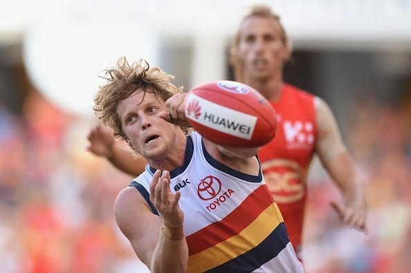 GOLD COAST, AUSTRALIA - MAY 21: Rory Sloane of the Crows handballs during the 2016 AFL Round 09 match between the Gold Coast Suns and the Adelaide Crows at Metricon Stadium on May 21, 2016 in Gold Coast, Australia. (Photo by Matt Roberts/AFL Media)